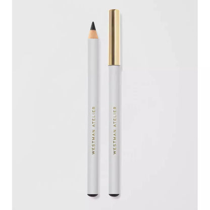 A white eyeliner pencil with its cap placed to the side on a light background.