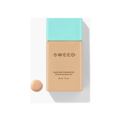 Bottle of liquid foundation with a swatch of the makeup shade displayed below it.