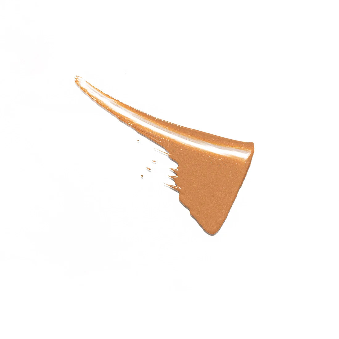 A smear of liquid foundation makeup against a white background.